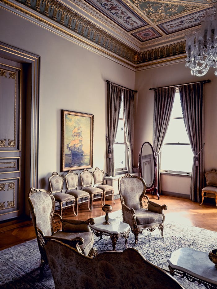 services-01 Luxurious antique living room interior featuring elegant furniture and ornate decor in natural light.