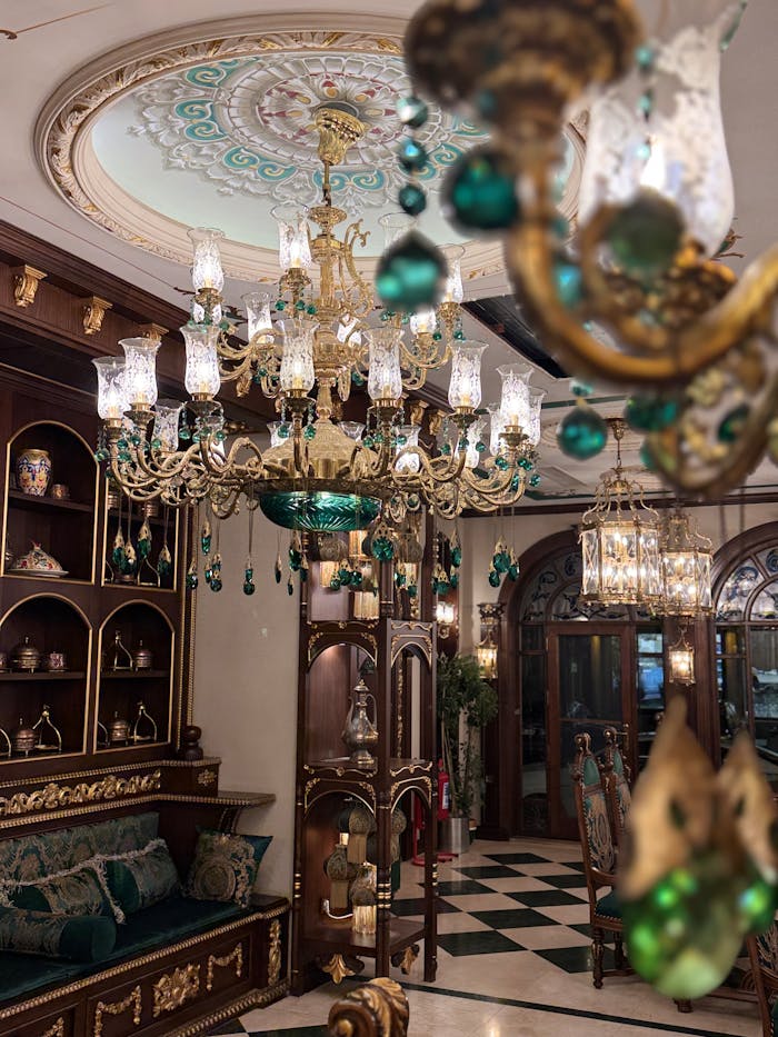 services-04 Opulent room featuring ornate chandeliers and classic vintage decor.