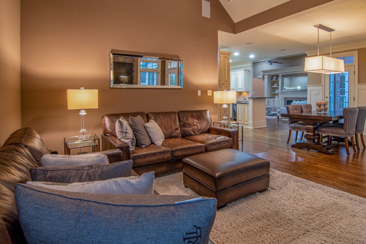 The Art of Drawing Readers In: Your attractive post title goes here Spacious living room with modern furniture and warm lighting for a cozy atmosphere.